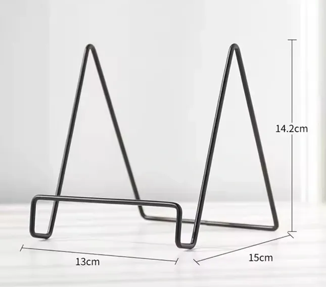 Black metal display stand for photos.