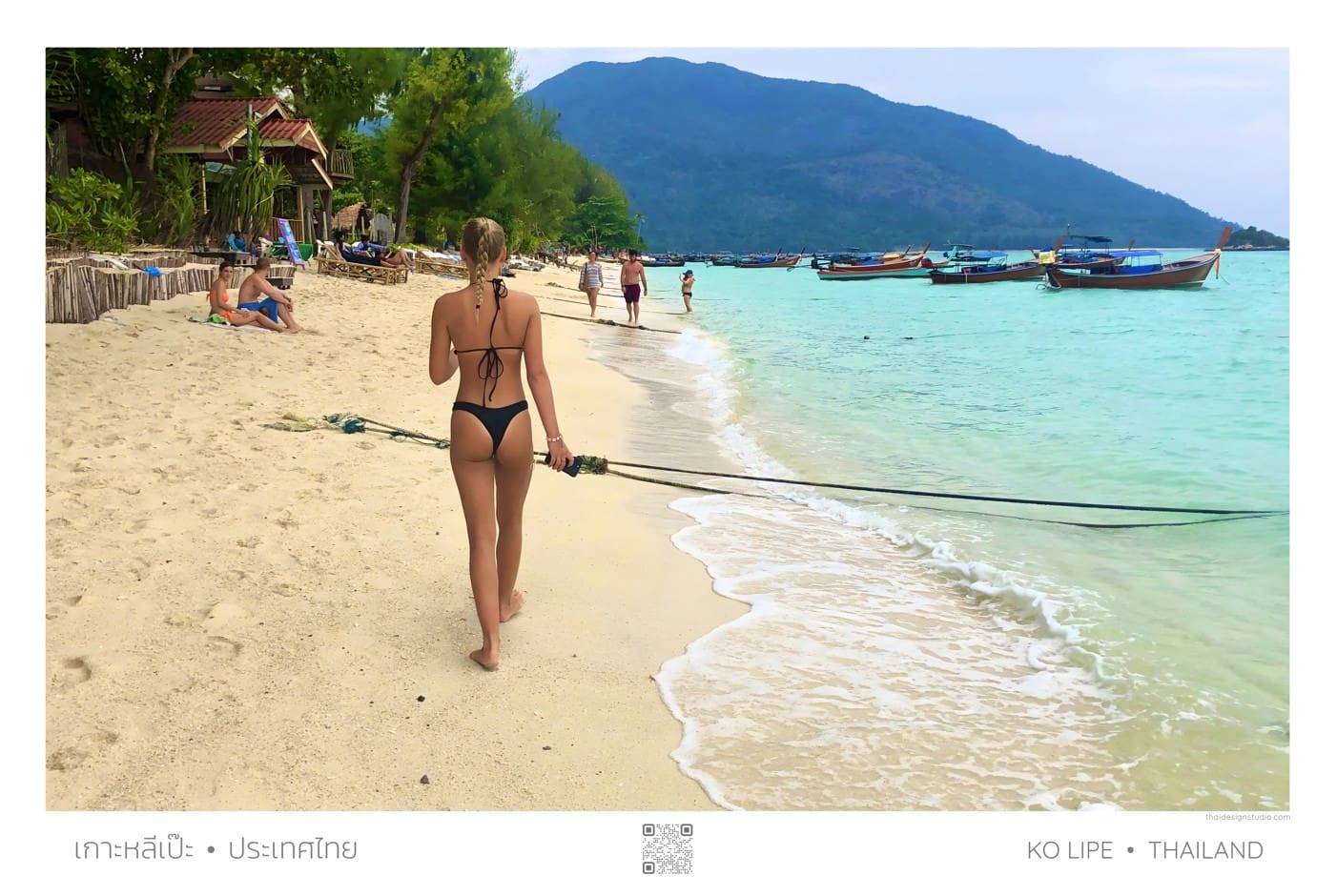 Woman walking on Ko Lipe beach.